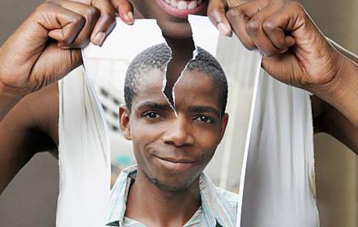 Young woman tearing a picture of a man - stock photo