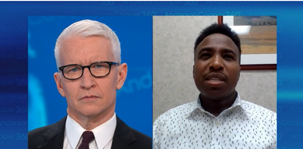 Kennedy Wainaina speaking with CNN's Anderson Cooper