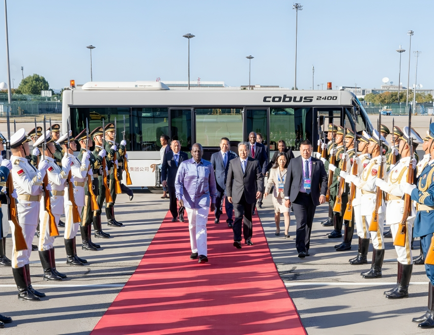 President William Ruto inspects a guard of honour in China