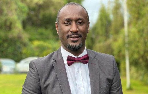 Caleb Karuga poses for a photo