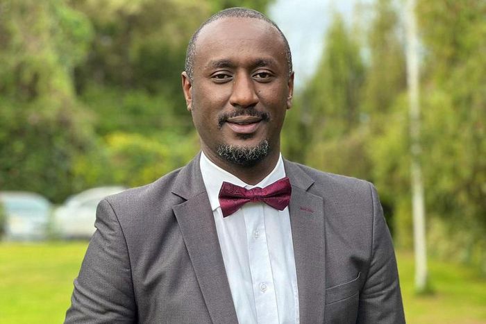 Caleb Karuga poses for a photo