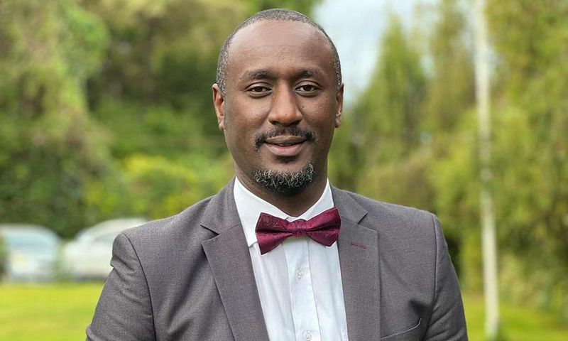 Caleb Karuga poses for a photo