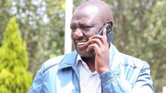 File image of President William Ruto on a phone call