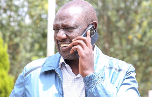 File image of President William Ruto on a phone call