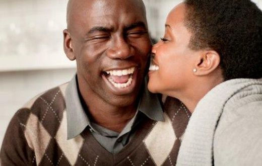 Young lady kissing older man