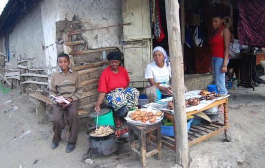 Tanazania n woman cooking and selling bereal