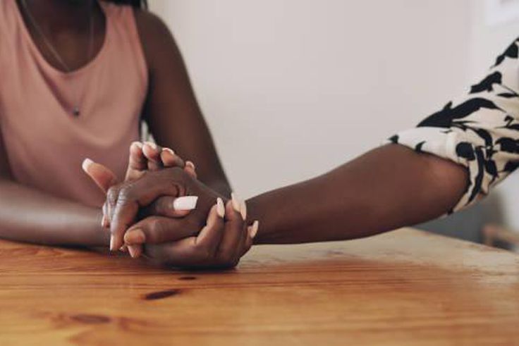 A person comforting a bereaved person