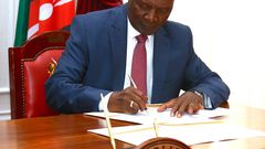 Treasury CS Njuguna Ndung'u signing a Sh400 billion loan with the AfriExim bank at State House on May 2, 2023