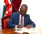 Treasury CS Njuguna Ndung'u signing a Sh400 billion loan with the AfriExim bank at State House on May 2, 2023