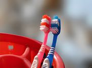Place your toothbrush next to his