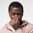 Black man holding his nose (image used for illustration) [iStock]