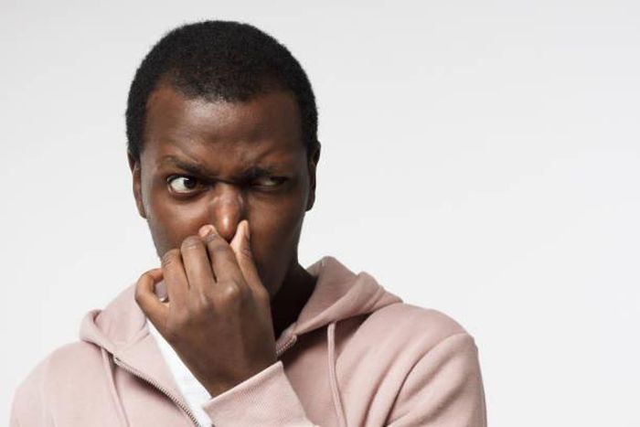 Black man holding his nose (image used for illustration) [iStock]
