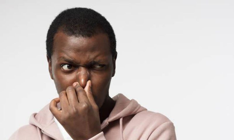 Black man holding his nose (image used for illustration) [iStock]