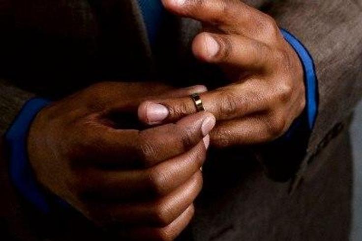 Man taking off wedding ring