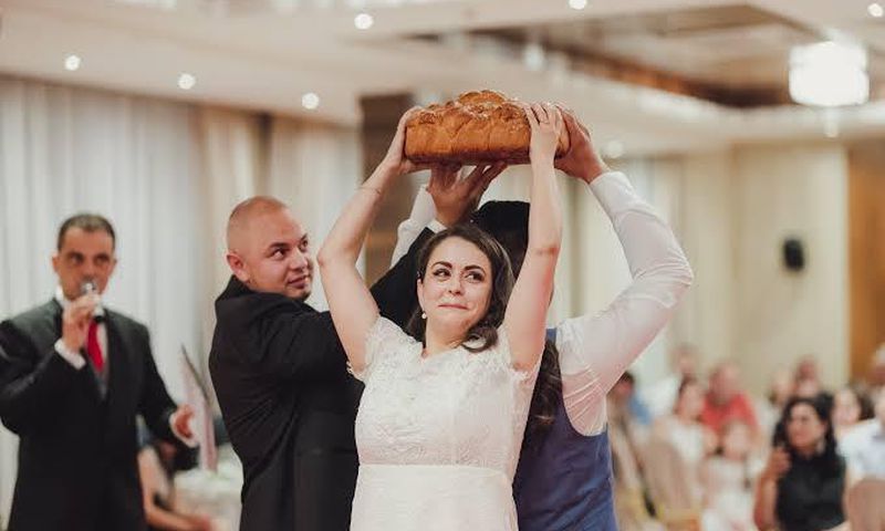 Bread breaking tradition in Bulgarian wedding [Lee Ann Belter]