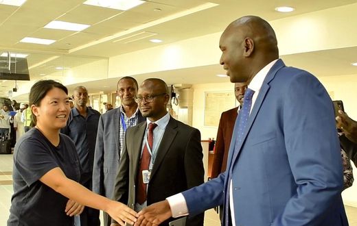 Immigration PS Julius Bitok meets Ms Kyung Sang Yoo, who was among the first visa-free travellers to Kenya