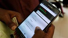 A person using M-pesa