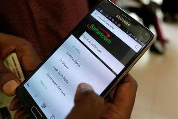 A person using M-pesa