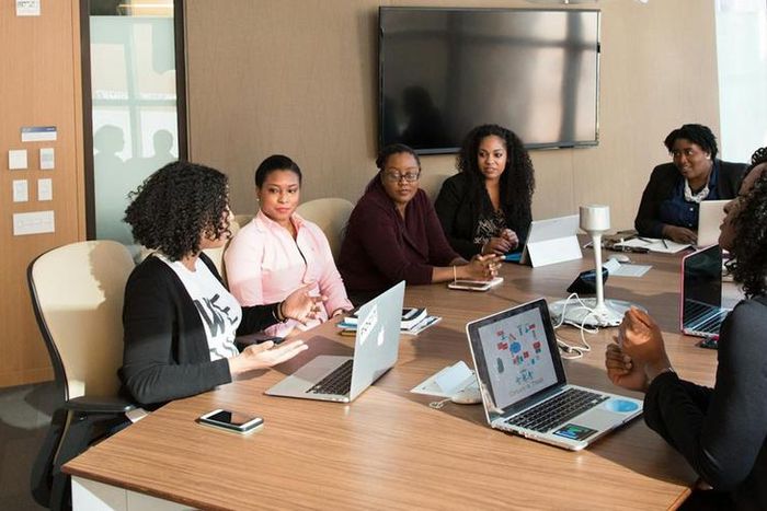 Executives at a business meeting [Image Credit: Christina Morillo]