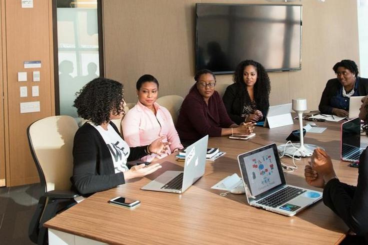 Executives at a business meeting [Image Credit: Christina Morillo]