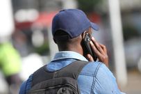 A Kenyan using a mobile phone