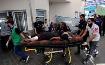 An injured Palestinian woman is wheeled into the al-Shifa hospital, following Israeli airstrikes on Gaza City, central Gaza Strip, Sunday, Nov. 5, 2023.AP Photo/Abed Khaled