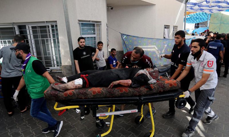 An injured Palestinian woman is wheeled into the al-Shifa hospital, following Israeli airstrikes on Gaza City, central Gaza Strip, Sunday, Nov. 5, 2023.AP Photo/Abed Khaled