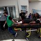 An injured Palestinian woman is wheeled into the al-Shifa hospital, following Israeli airstrikes on Gaza City, central Gaza Strip, Sunday, Nov. 5, 2023.AP Photo/Abed Khaled