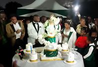 Milly Wa Jesus' brother Leon & his bride Diana cutting the cake on their wedding day