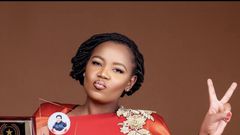 Lynn Ngugi accepting an award