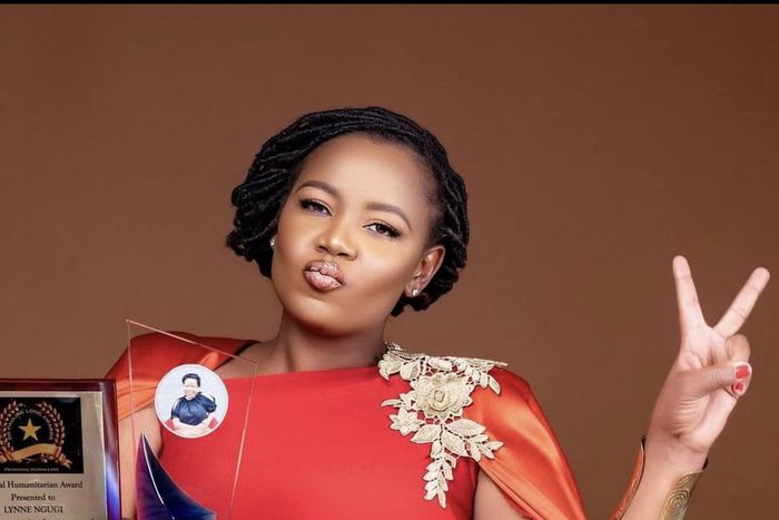 Lynn Ngugi accepting an award