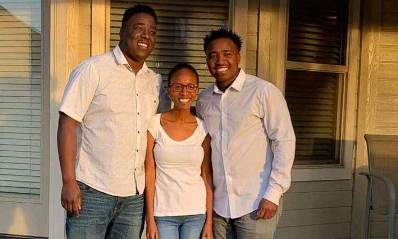 Irene Gakwa and brothers Chris and Kennedy stand in family photo