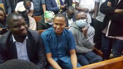 Director of Press Service at Office of the Prime Cabinet Secretary Salim Swaleh alongside other suspects in court