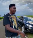 Youth flaunting expensive cars