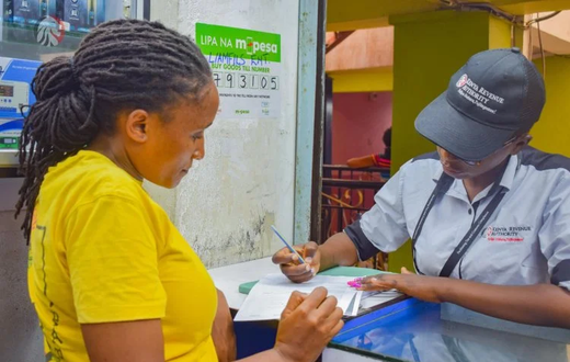 A KRA Revenue Service Assistant RSA attending to a businesswoman in Nairobi on September, 27 2023
