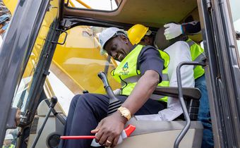 President William Ruto takes charge of a grader during the groundbreaking ceremony for affordable housing project in Thika town on Wednesday, August 9, 2023