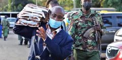 A police officer providing escort during the administration of national exams
