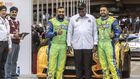 Karan Patel (R) and Tauseef Khan (L) pose for a photo with former president Uhuru Kenyattta during the Safari Rally Kenya 2022 which was held from June 23 to 26, 2022