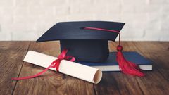 A photo illustration showing a graduation cap