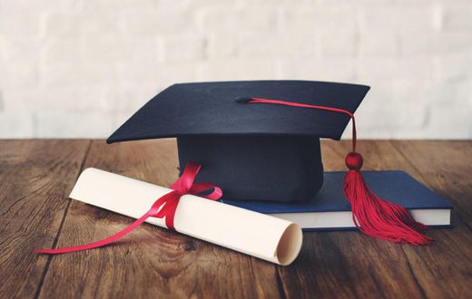 A photo illustration showing a graduation cap