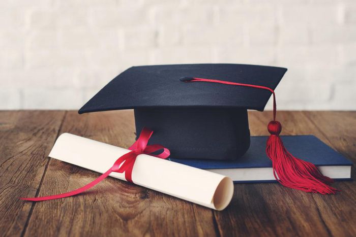 A photo illustration showing a graduation cap