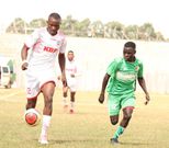 Ulinzi Stars  defender Masita Masuta vies for the ball with Vihiga Bullets attacker