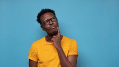 Black man thinking [Adobe Stock]