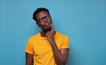 Black man thinking [Adobe Stock]