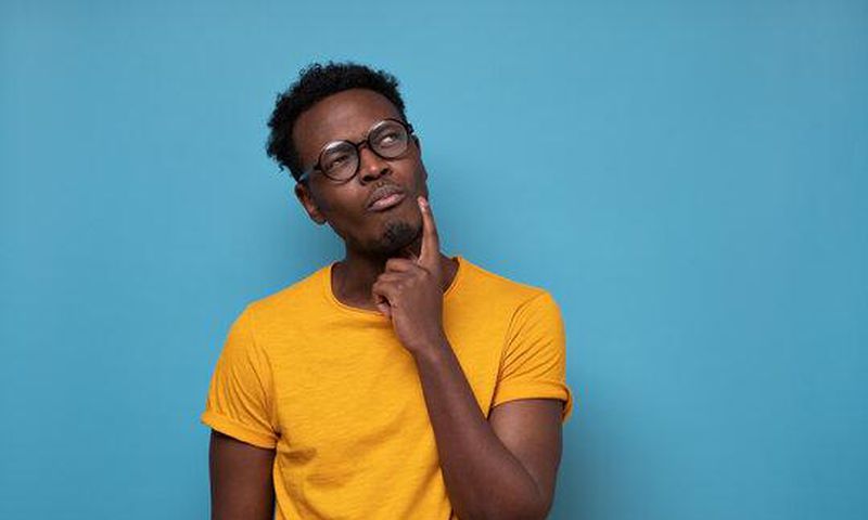 Black man thinking [Adobe Stock]