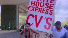 Eric Omondi pulling a hand cart