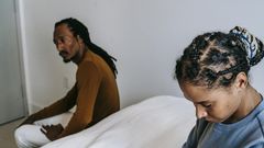 Couple having a conflict in the bedroom