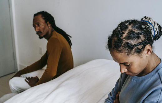 Couple having a conflict in the bedroom