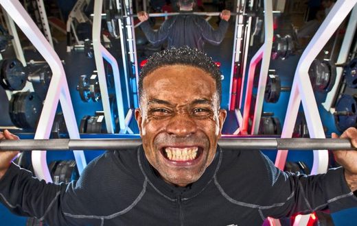 A man lifting weights at the gym