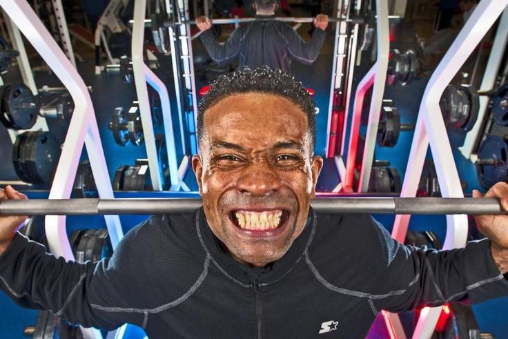 A man lifting weights at the gym